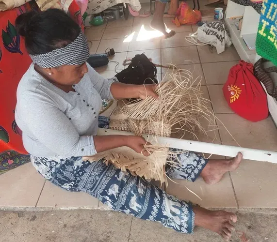 Barbara demonstrates weaving pandanus